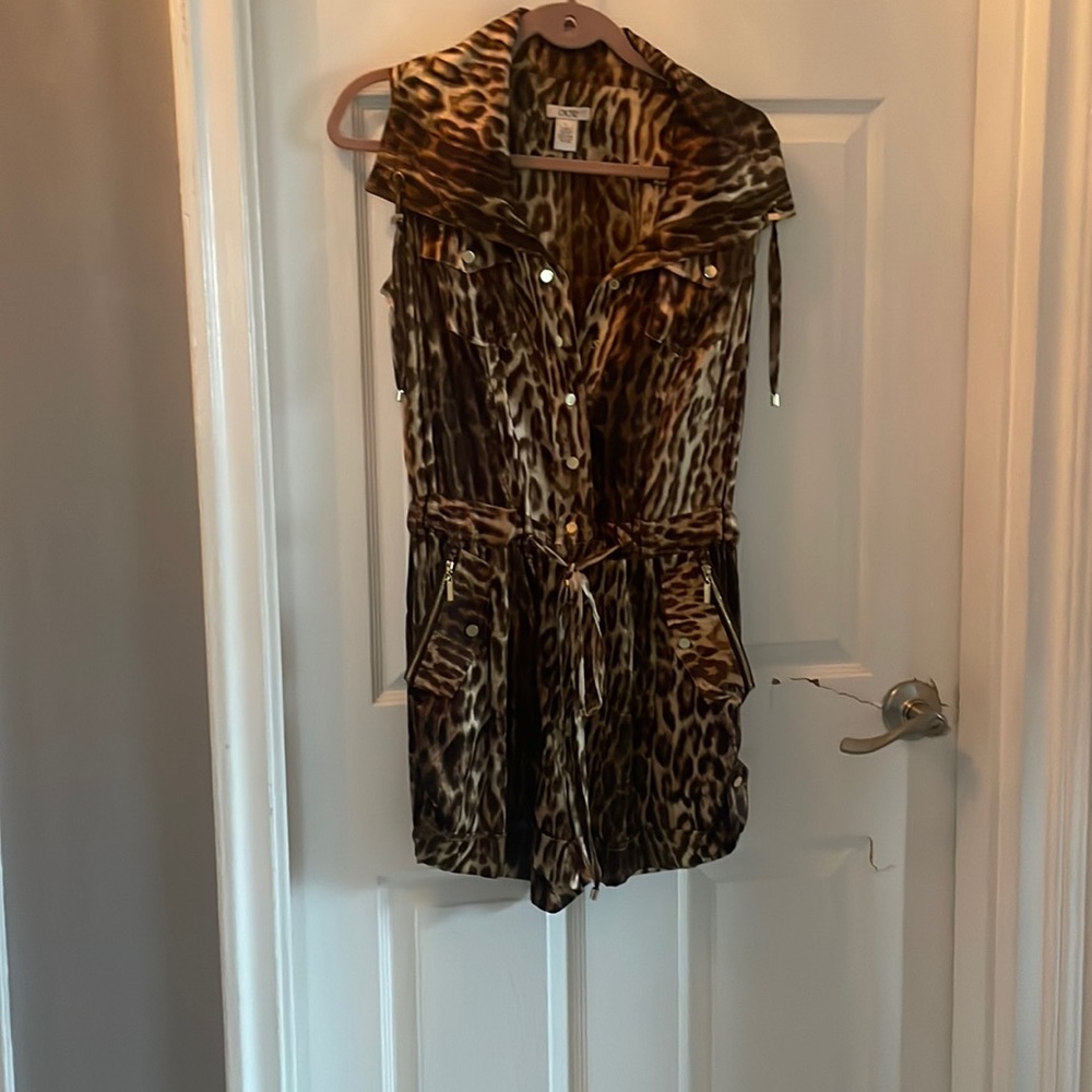 Leopard jump suit with gold zippers on the pockets and gold buttons